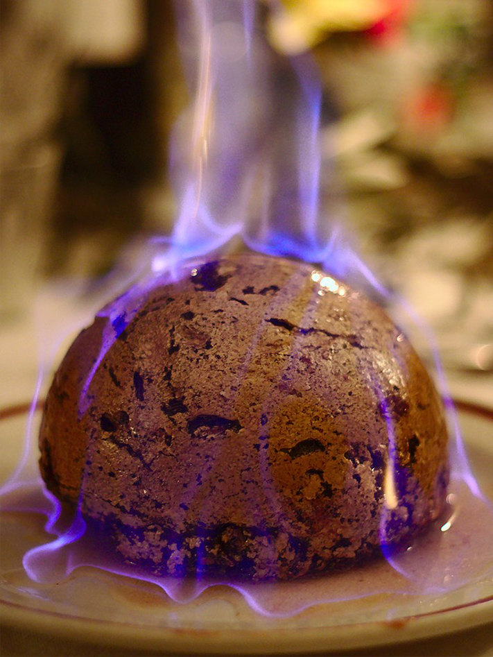 christmas pudding being flamed